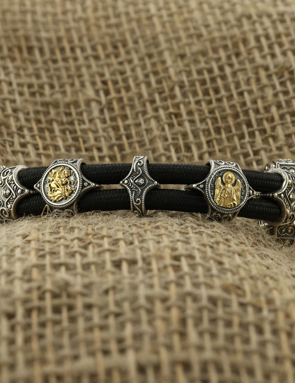 Браслет из серебра 925 пробы и золота 750 пробы c ониксом и шёлковым шнурком