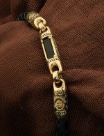 Браслет из лимонного золота c кожаным шнурком и ониксом