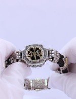 Браслет из серебра 925 пробы и золота 750 пробы c ониксом и шёлковым шнурком