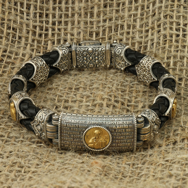 Браслет из серебра 925 пробы и золота 750 пробы c кожаным шнурком