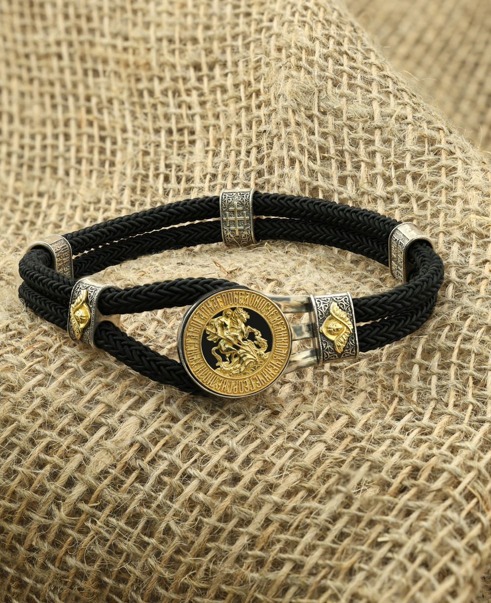 Браслет из серебра 925 пробы и золота 750 пробы c ониксом и шёлковым шнурком