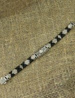 Браслет из серебра и золота c кожаным шнурком