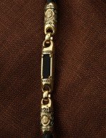 Гайтан из лимонного золота c кожаным шнурком и ониксом